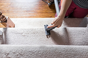 Vacuuming carpeted stairs