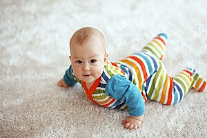 cute baby playing on the newly cleaned carpet